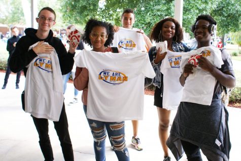Trenton Niles, Nina Brooks, Marek Simmons, Alyssa Key, and Andres Montilla display school pride with the new t-shirts and chick-fil-A sandwiches they earned by making learning gains.