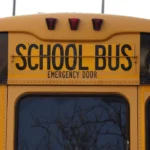 Kansas Highway Patrol investigates a school bus crash on a busy Riley County roadway