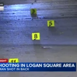 Chicago police tape near a street scene in Logan Square after a shooting