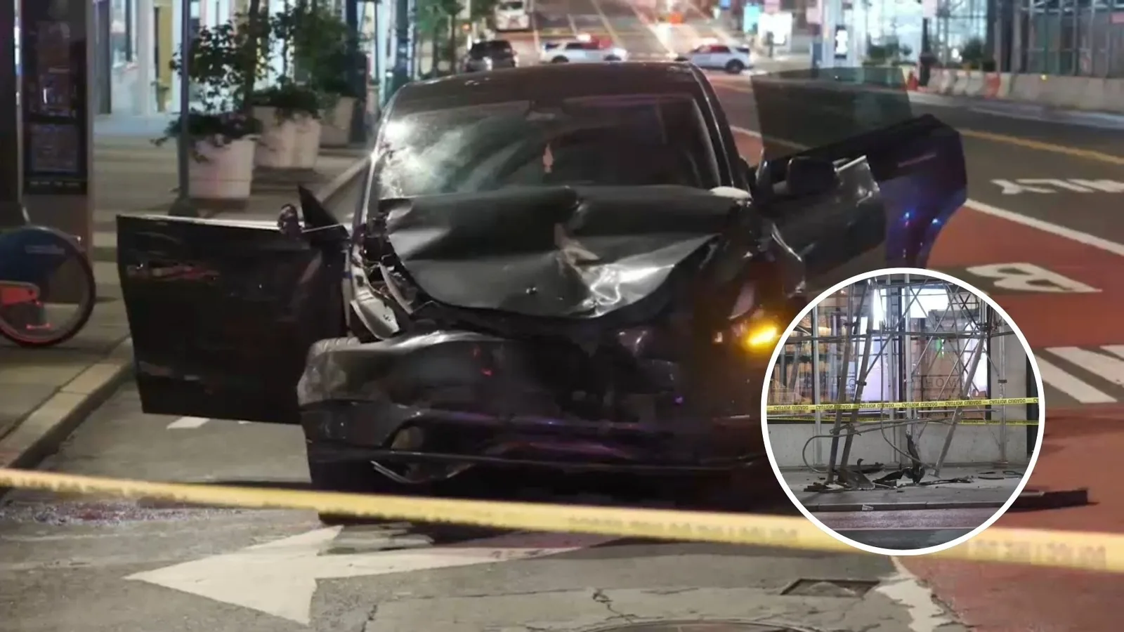 Police investigate a Tesla crash site near Midtown scaffolding and street fixtures in Manhattan
