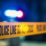 Police lights near a South Union Boulevard crash scene in Colorado Springs