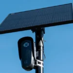 Milford police car parked near a license plate reader camera mounted on a roadside pole