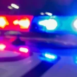 Colorado Springs police car at a nighttime scene after a hit and run dispute and arrest
