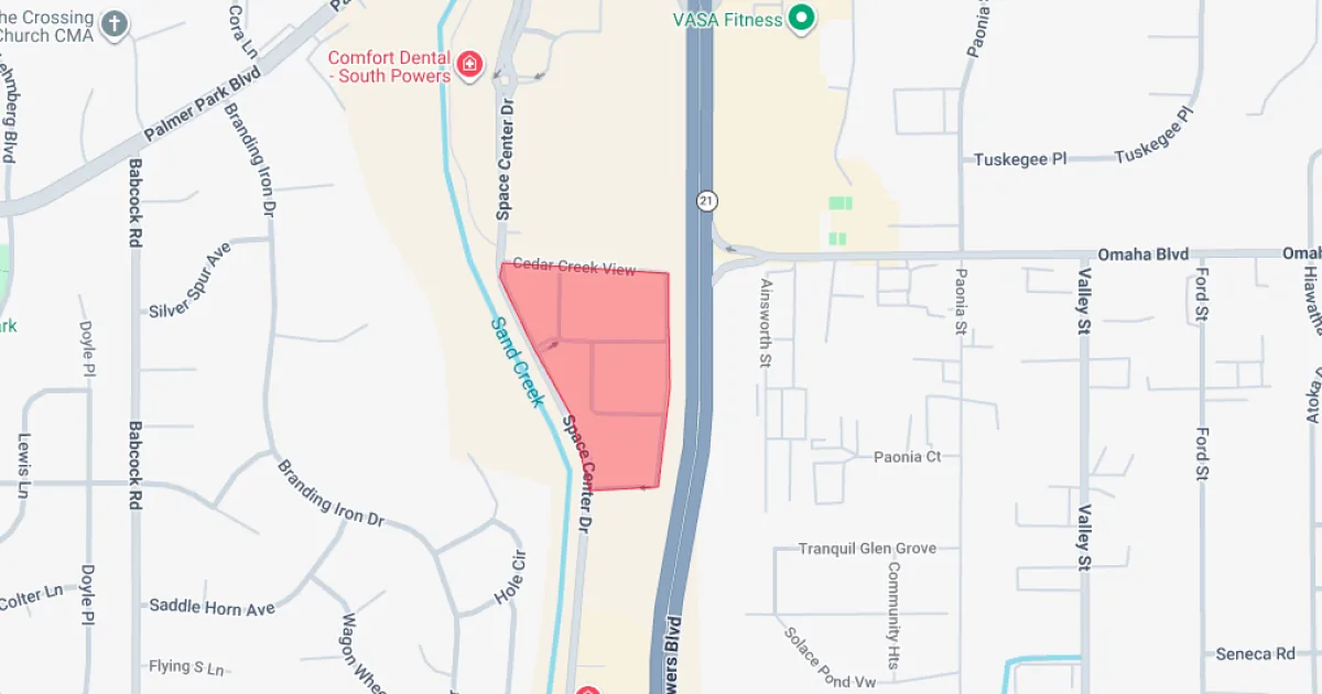 Colorado Springs police cars responding to a shelter-in-place at an apartment complex